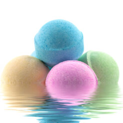 Bath bombs in the water with reflection